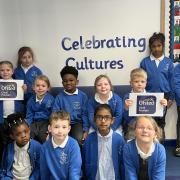 Students of Merton Infant School celebrate the success