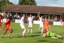 Hartley Wintney and Truro City players battle for a ball. Credit: Josie Shipman
