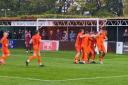 Hartley Wintney players celebrate their goal against Hanwell Town