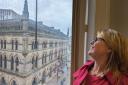 Kersten England, who is now chair of Bradford Culture Company, looks out to the Wool Exchange in Bradford City Centre