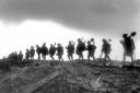 Photo of a working party of the Manchester Regiment moving up to the trenches near Serre in France, January 1917 on display at IWM North