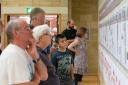 Visitors look at the information on display at First World War exhibition
