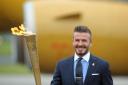 David Beckham carrying the torch