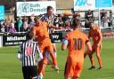 Hartley Wintney and Bath City players fight for the ball. Credit: Josie Shipman