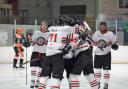 Tom Banner is mobbed by his teammates after scoring his first senior goal. Pic by Jo Loat