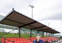 Cllr Jenny Vaux stands in front of the new spectator stand at Down Grange Sports Complex.
