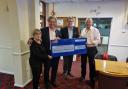 Club chairman Andrew Chandler pictured right presenting the cheque Merv Rees and Ian Harrison from the ARK Charity Centre