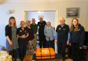RNLI Basingstoke and members of Connecting our Communities programme following the scroll signing