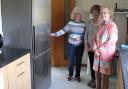 Oakley Bowling Club members with a new fridge freezer bought with the grant money