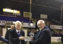 Peter Raynbird presented with his crystal bowl by Mick Davis