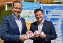 Kevin White, right, and Alex Macintyre, left, directors of Fortem Financial Education, with the Moneypenny stones that Kevin has created and will be placing near local schools taking part in Ark Day. Image: Rod Clarke