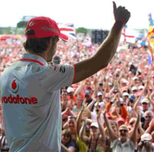 PARTY TIME: Jenson Button salutes Silverstone crowds. Inset, the race start.