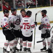 Paul Petts and Hallam Wilson (second and third from left) during a Bison game last season.