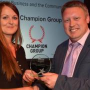 Kevin Croombs, group accountant at Champion Group, receives the Business and the Community award on behalf of the company at the 2018 A Place to be Proud of Awards