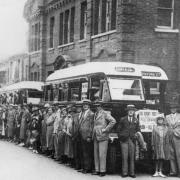 John Mares’ staff gather before a coach outing in pre-war days.