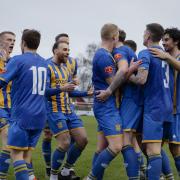 Basingstoke players celebrate their win against Poole