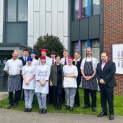 Restaurant manager Daniel Spittle right, staff and students