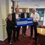 Club chairman Andrew Chandler pictured right presenting the cheque Merv Rees and Ian Harrison from the ARK Charity Centre