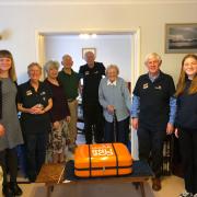 RNLI Basingstoke and members of Connecting our Communities programme following the scroll signing