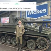Paul Gibbons outside the store with the 'tank'