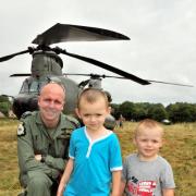 Flt Lt John Stevens, from RAF Odiham, with Tyler Haw-Davidson, four, and Hayden Haw-Davidson, two, from Old Basing