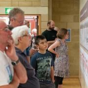 Visitors look at the information on display at First World War exhibition