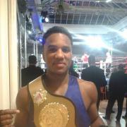 Jacob Gabriel celebrates with his title belt