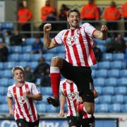 Aaron Martin celebrates a late winner against Coventry City in the FA Cup