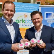 Kevin White, right, and Alex Macintyre, left, directors of Fortem Financial Education, with the Moneypenny stones that Kevin has created and will be placing near local schools taking part in Ark Day. Image: Rod Clarke