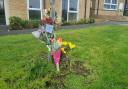 Tributes left at Braddock Court after man in 40s was stabbed to death