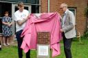 Enzo Riglia and Casey Taylor unveil the sculpture at The Orchard in Basingstoke