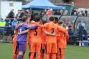the Hartley squad in the pre match huddle. Pic by Josie Shipman
