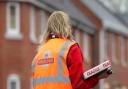 File photo of a Royal Mail staff member delivering post. Picture: PA Images