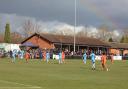 A rainbow is see above the ground as Hartley Wintney play Poole Town