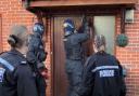 Police carrying out a warrant at an address on Highpath Way in Basingstoke on Monday, March 4.