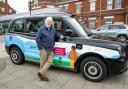 Cllr Chris Tomblin with one of the new low-emission taxis