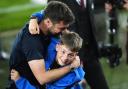 Saints manager Russell Martin celebrates with his son at full-time