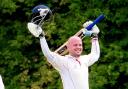 Odiham and Greywell's Philip Thomas celebrates making a century against Basingstoke and North Hants III