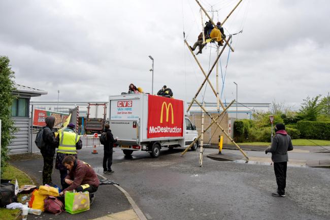 Animal Rebellion block the McDonald's distribution depot in Houndmills, Basingstoke on Saturday morning.
Animal Rebellion barricade four McDonald's distribution centres affecting supplies to 1,300 UK branches using trucks and bamboo structures