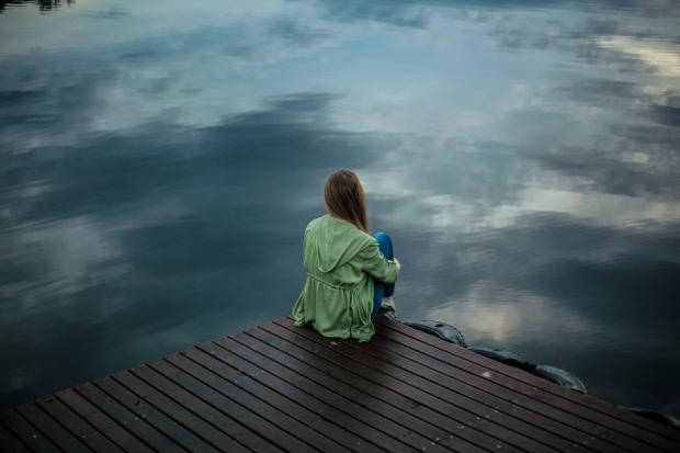 Basingstoke Gazette: A woman looking out on to the water. Credit: Canva