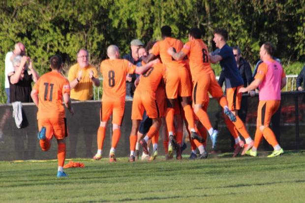 Hartley Wintney players celebrate wild after their injury time winner