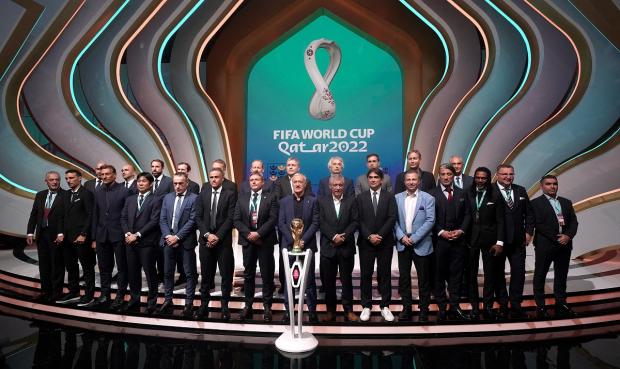 Basingstoke Gazette: Managers, including England manager Gareth Southgate (back row third left), on stage during the FIFA World Cup Qatar 2022 Draw. Picture: PA