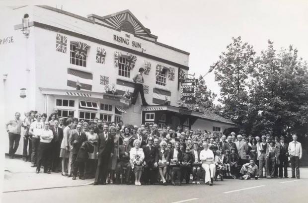 Basingstoke Gazette: Customers outside The Rising Sun pub in Basingstoke celebrating the silver jubilee of Queen Elizabeth II in 1977