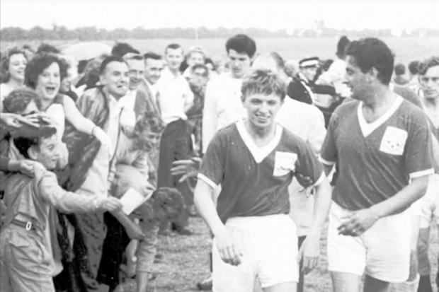 Tommy Steele and Bernie Winters leave the Camrosefootball ground after a charity match
