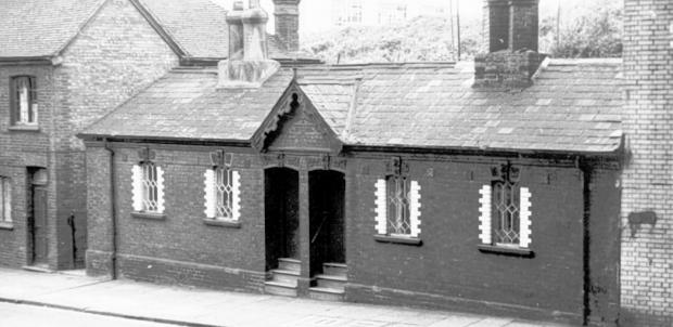Basingstoke Gazette: Soper’s Almshouses, established by John Burgess Soper in 1891, next to the ChapelStreet bridge