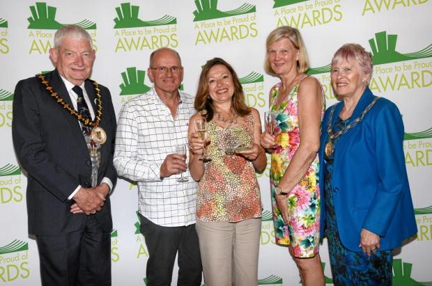 Basingstoke Gazette: Basingstoke Foodbank's team after winning the Place to be Proud of Awards. Credit: Sarah Gaunt photography