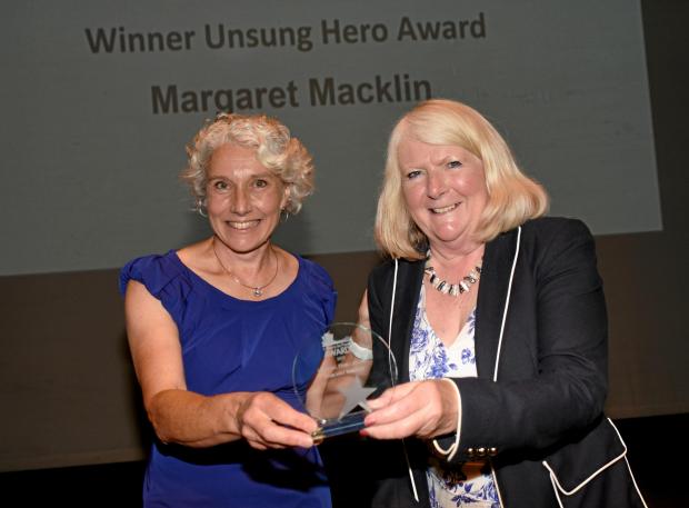 Basingstoke Gazette: Margaret Macklin receives the Place to be Proud of Awards from Destination Basingstoke managing director Felicity Edwards. Credit: Sarah Gaunt photography