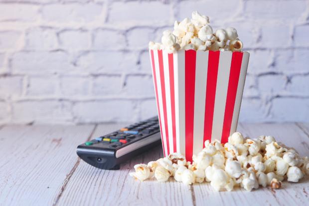 Basingstoke Gazette: A box of popcorn and a TV remote (Canva)