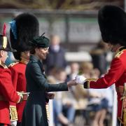 The Duchess of Cambridge hands sprigs of shamrock to an officer during her visit with the Duke of Cambridge to the 1st Battalion Irish Guards for the St Patrick's Day Parade, at Mons Barracks in Aldershot. Picture date: Thursday March 17, 2022. PA
