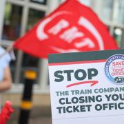 RMT union leaflets opposing plans to shut almost all UK railway ticket offices.